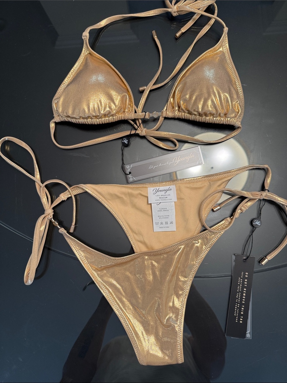 YoungLA Metallic Gold Tie-String Bikini
Bra is small bottom is medium